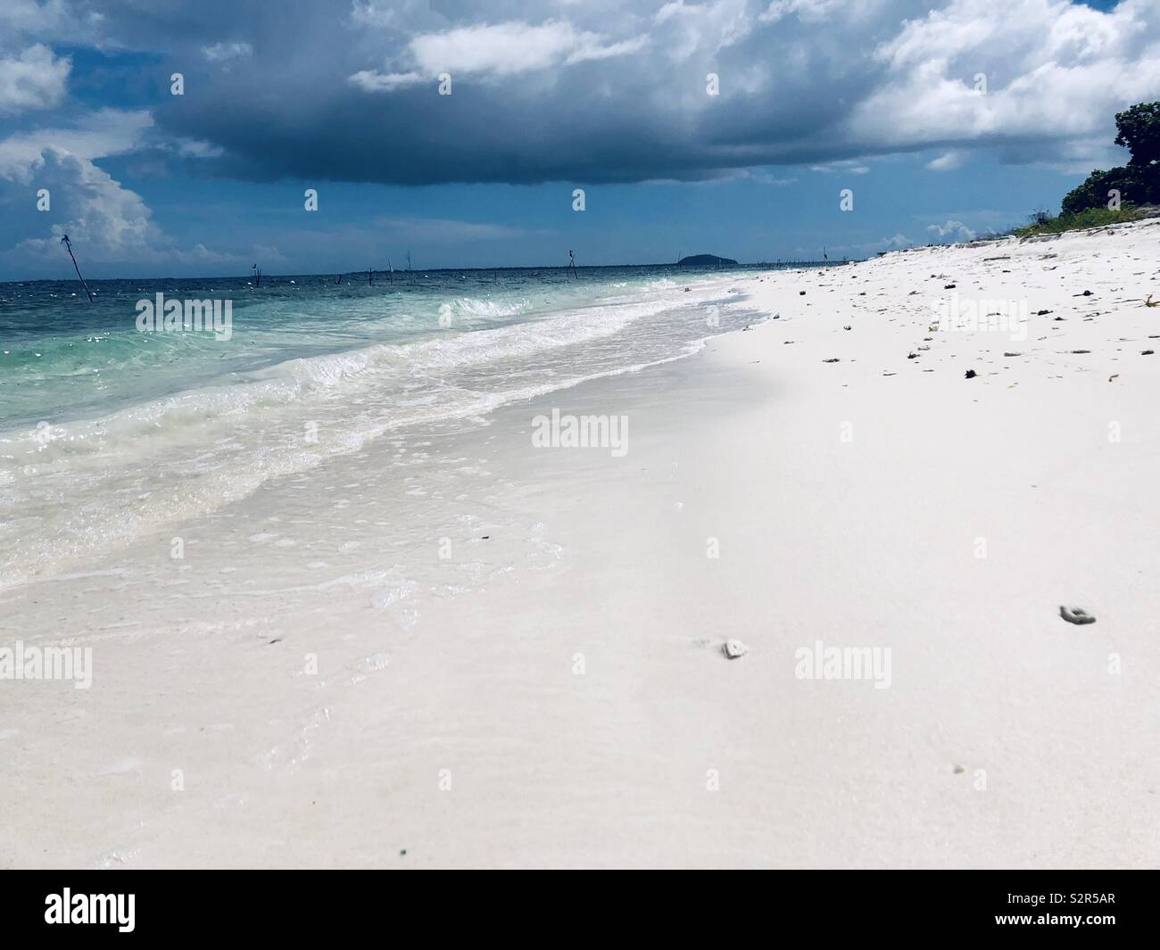 White powdery sand of Minis Island in conflicted torn town of Patikul, Sulu in Southern Philippines. Stock Photo