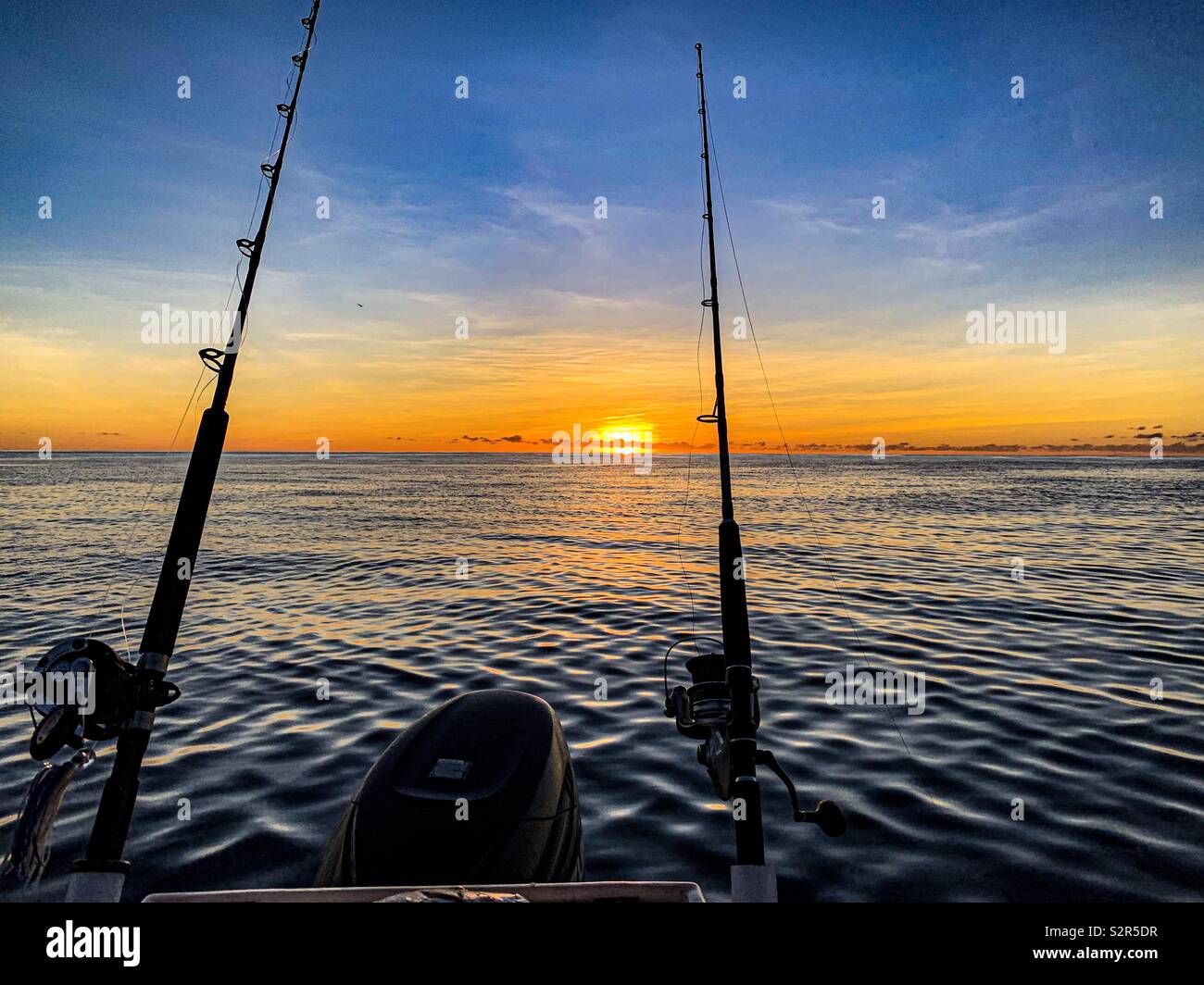 Boat Fishing on a calm day as the sun sets over Ningaloo Reef. - Smartphone Captured Stock Image