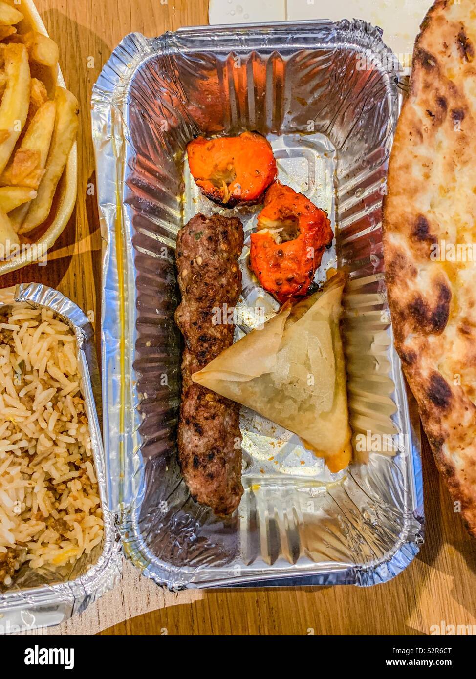 Tray of Indian mixed starter takeaway food - Smartphone Captured Stock Image