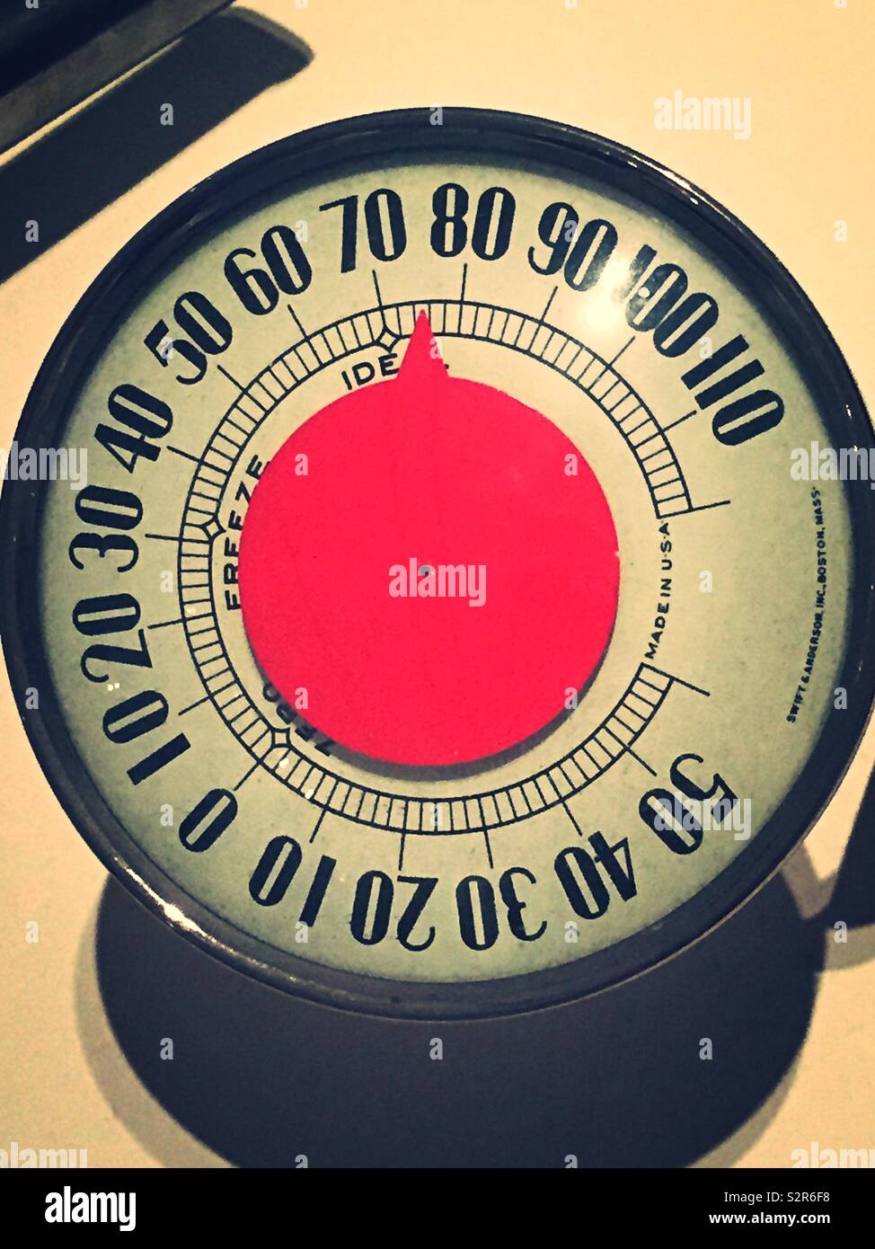 Vintage round analog thermometer, USA - Smartphone Captured Stock Image