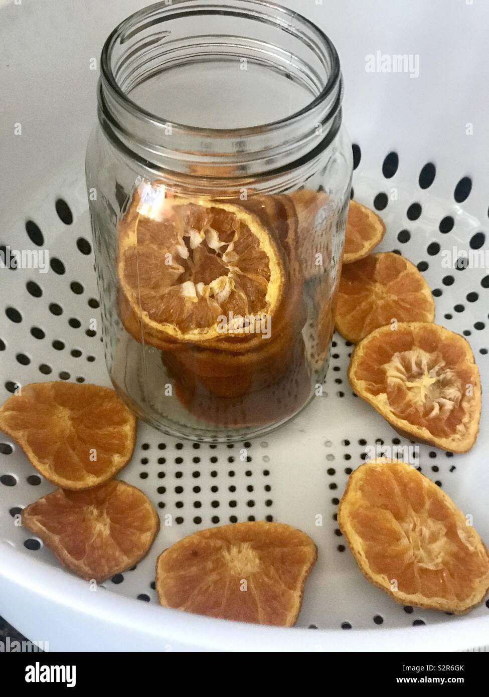 Dehydrated, dried Oranges in a glass mason jar in the kitchen Stock Photo Alamy