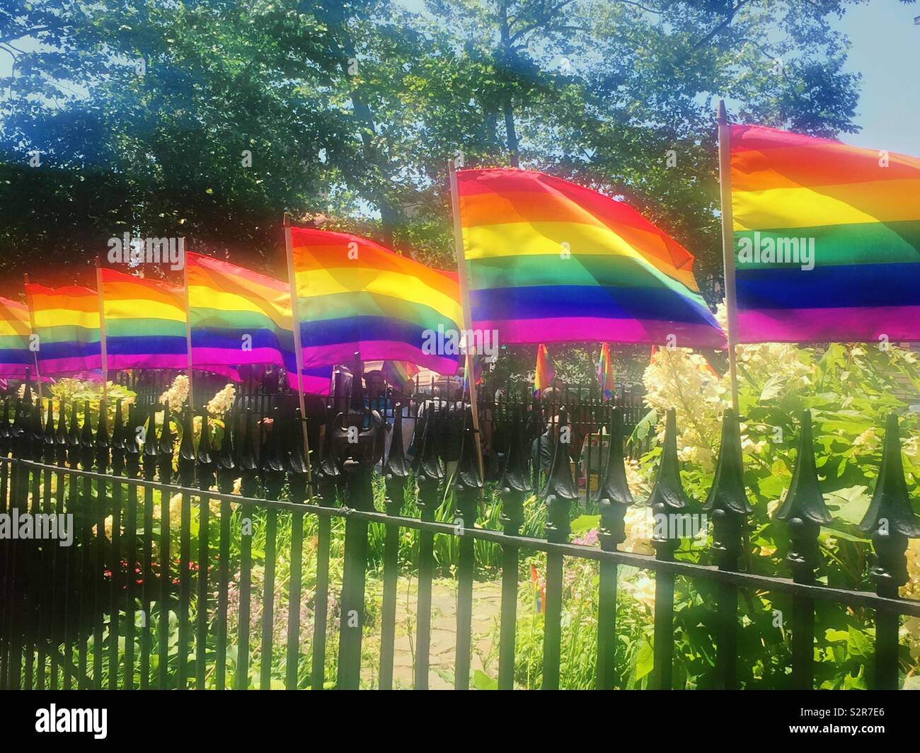 WorldPride Rainbow flags at the Stonewall national Monument, Greenwich village, New York City, USA - Smartphone Captured Stock Image