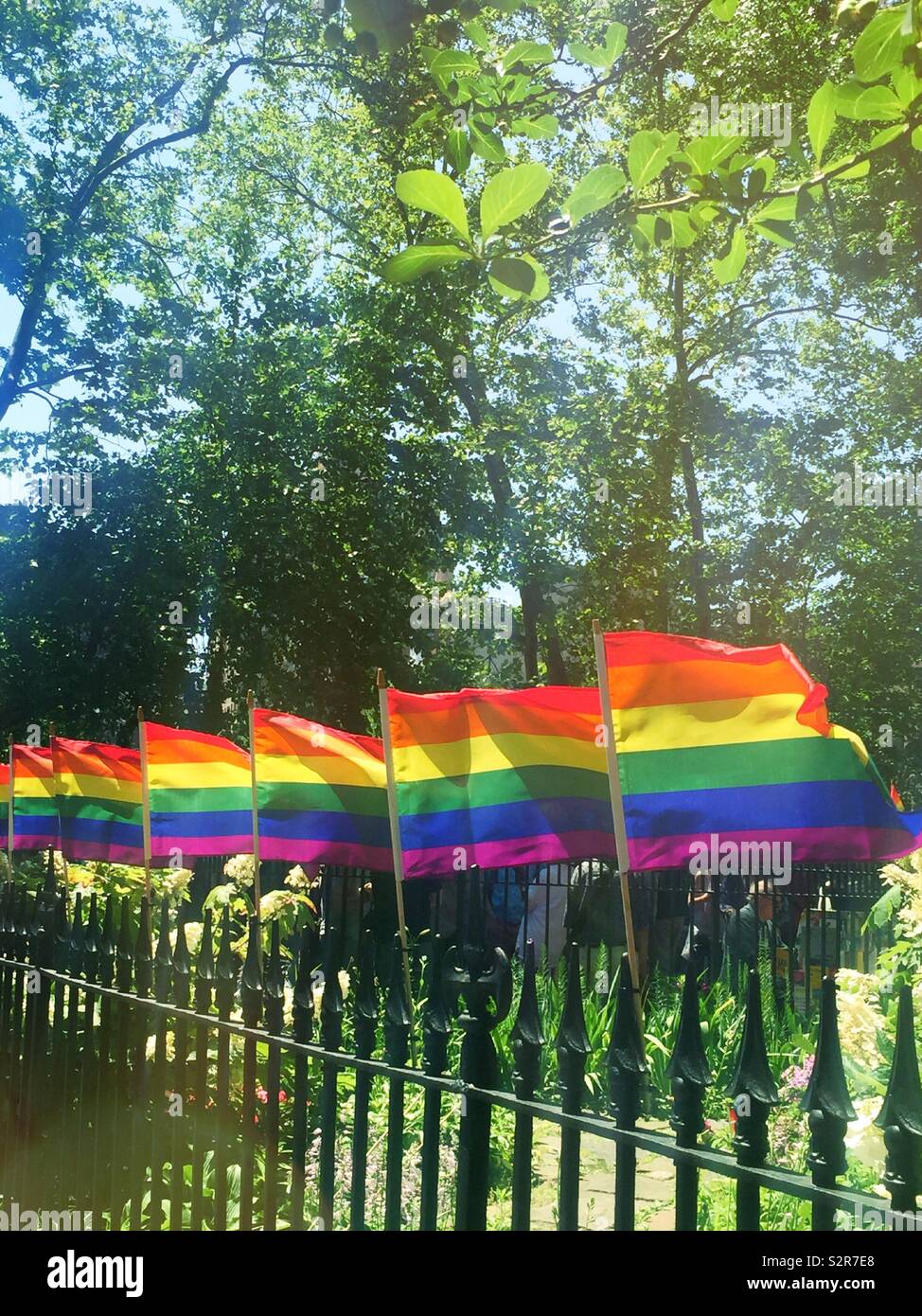 WorldPride Rainbow flags at the Stonewall national Monument, Greenwich village, New York City, USA - Smartphone Captured Stock Image
