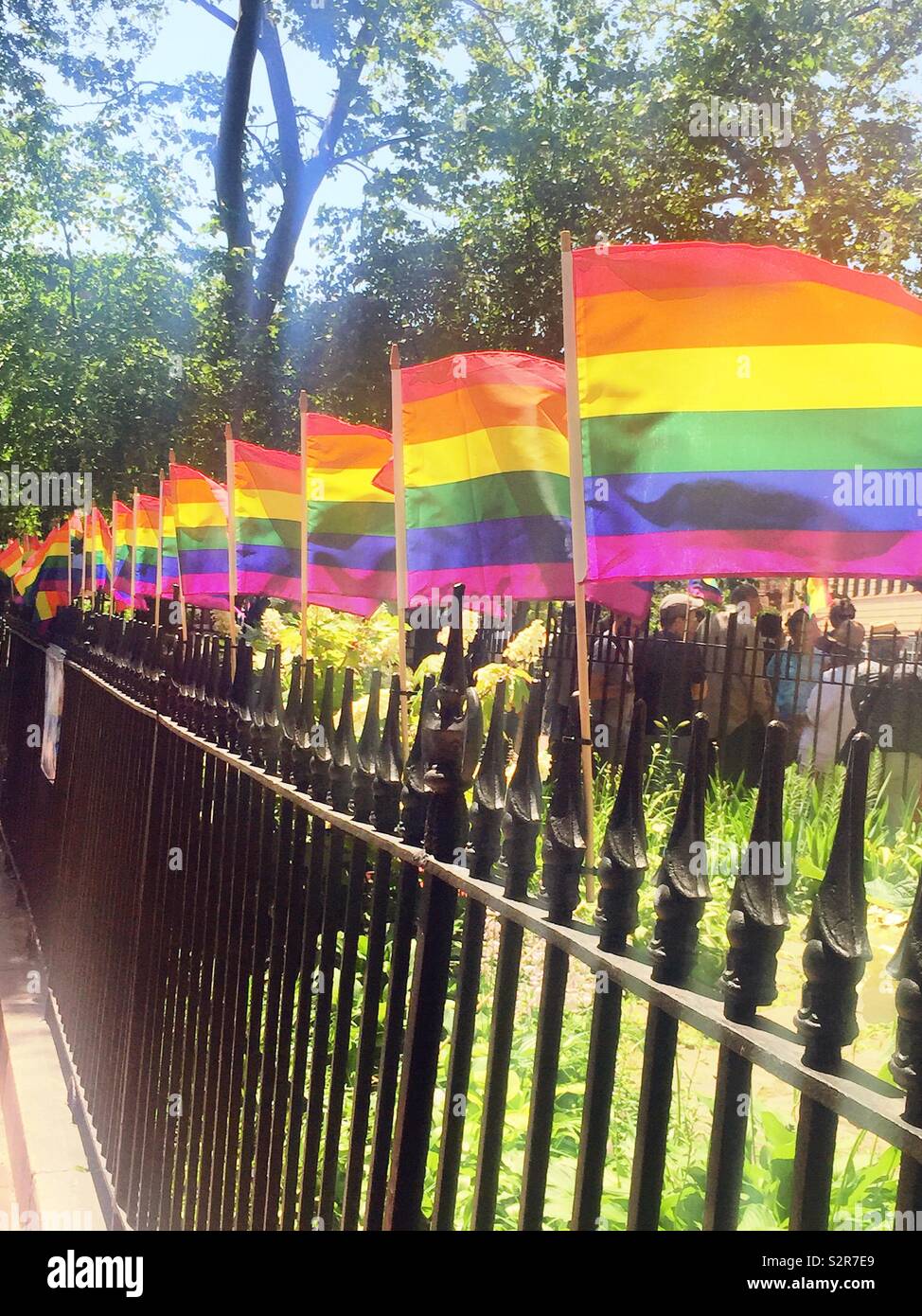 WorldPride Rainbow flags at the Stonewall national Monument, Greenwich village, New York City, USA - Smartphone Captured Stock Image