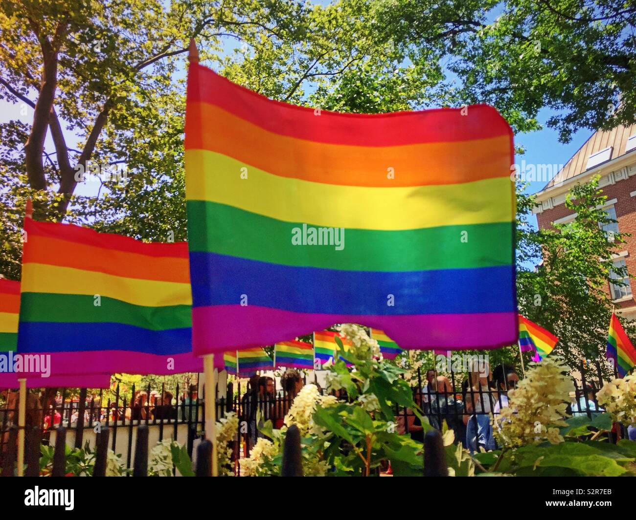 World pride rainbow flags at the Stonewall national Monument, Greenwich village, New York City, USA - Smartphone Captured Stock Image