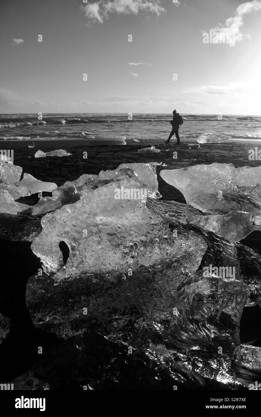Man walking on beach in Iceland Stock Photo