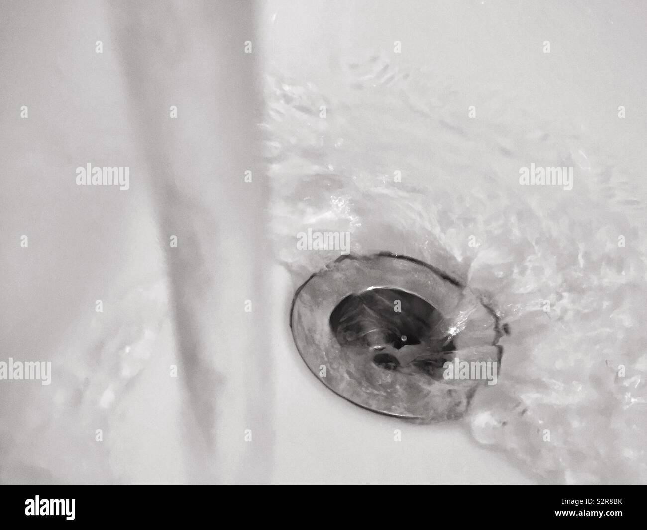 Water down the drain.  Washed away.  Running water Stock Photo