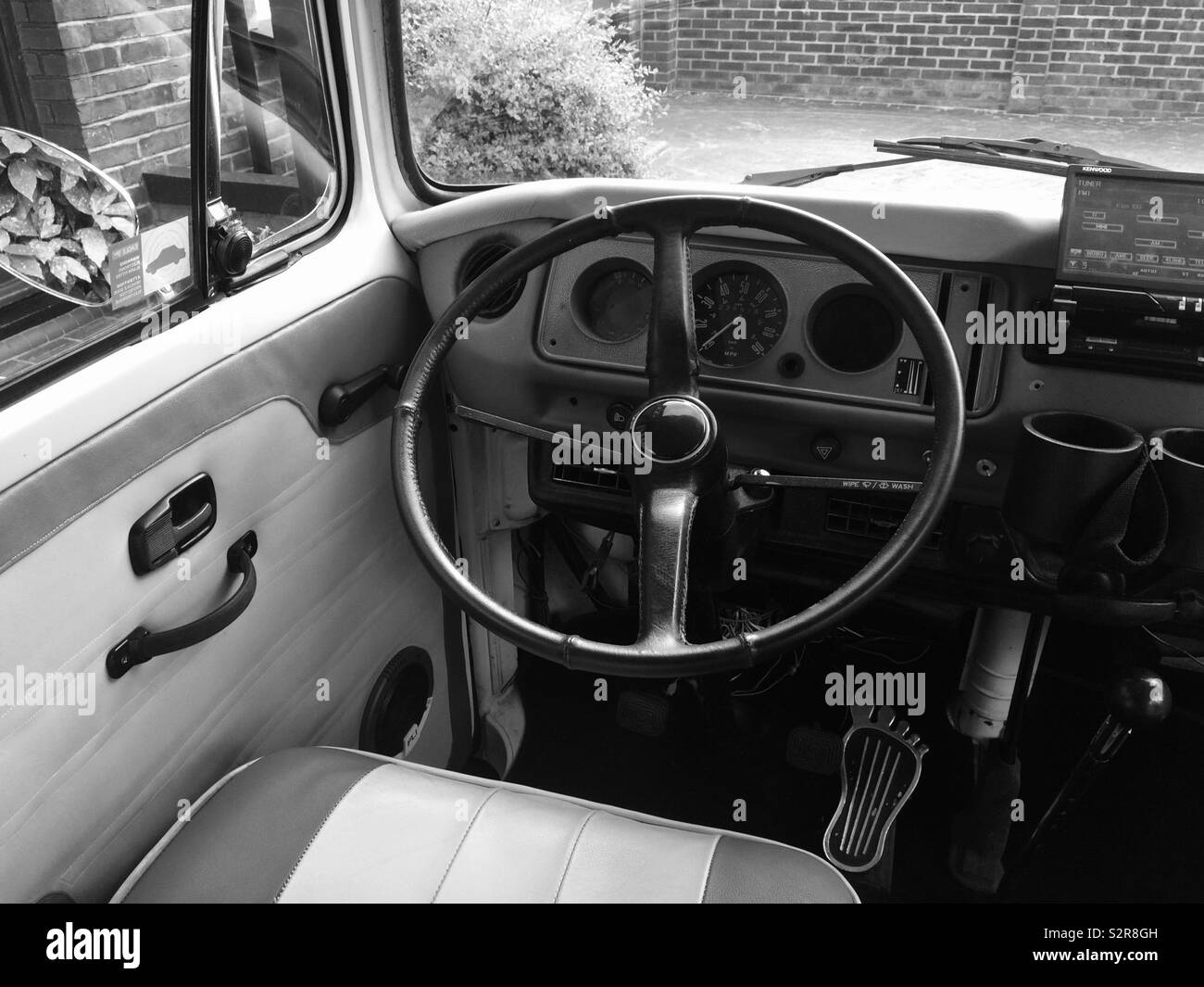 Vintage Volkswagen 1960’s camper van steering wheel and drivers seat Stock Photo