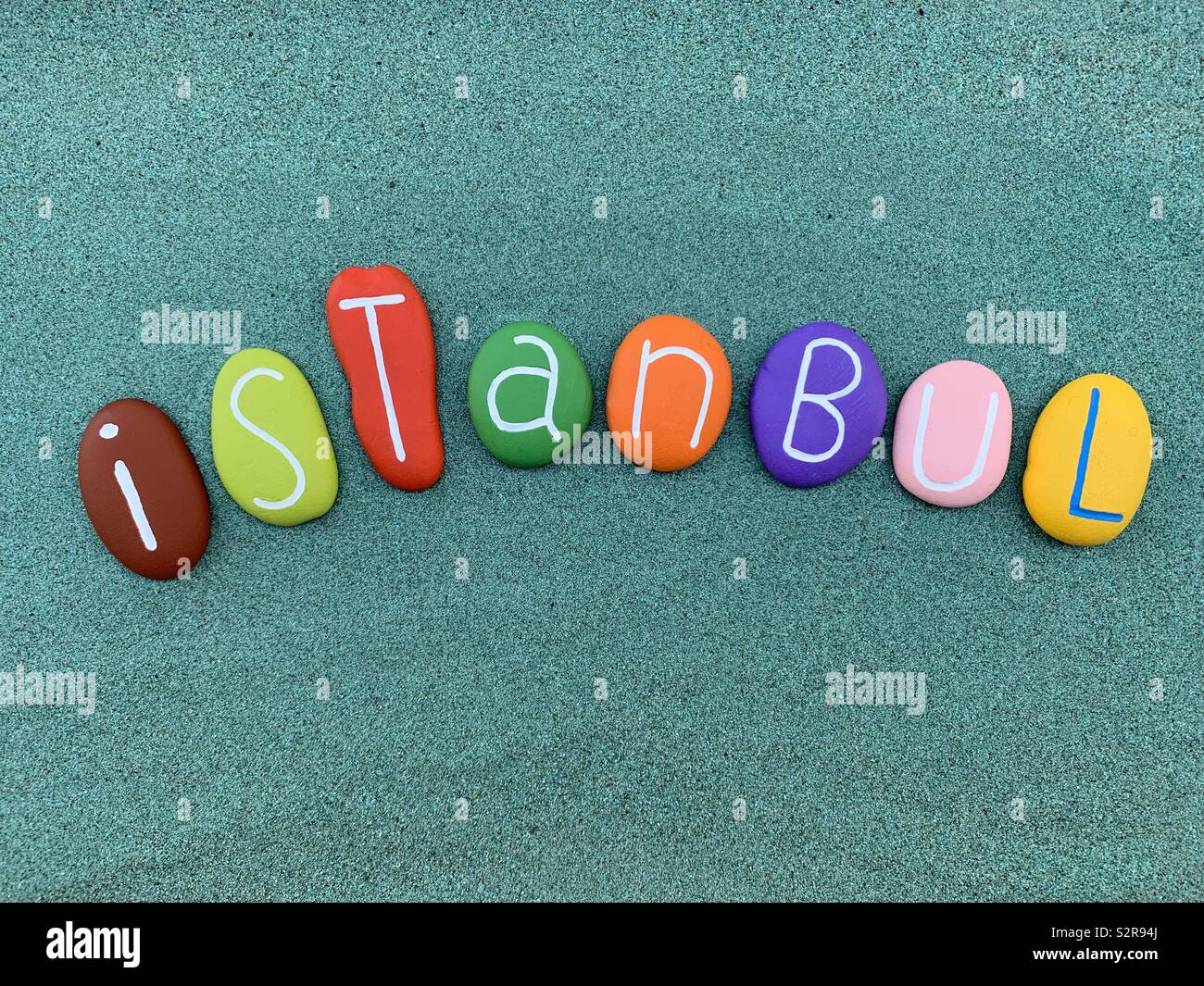 Istanbul, souvenir composed with multi colored pebbles over green sand - Smartphone Captured Stock Image