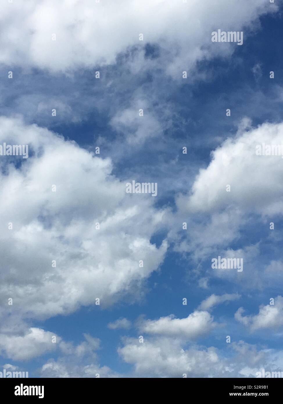 Cumulus clouds on a sunny day - Smartphone Captured Stock Image