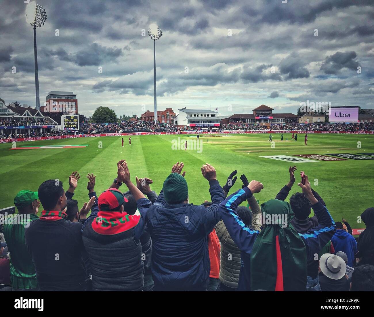 Bangladesh cricket fans enjoying themselves in the match against the West Indies at the Cricket World Cup at Taunton, Somerset - Smartphone Captured Stock Image
