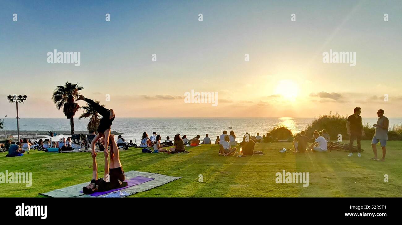 A beautiful sunset watched by a large crowed at Spiegel park in Tel-Aviv  Stock Photo - Alamy