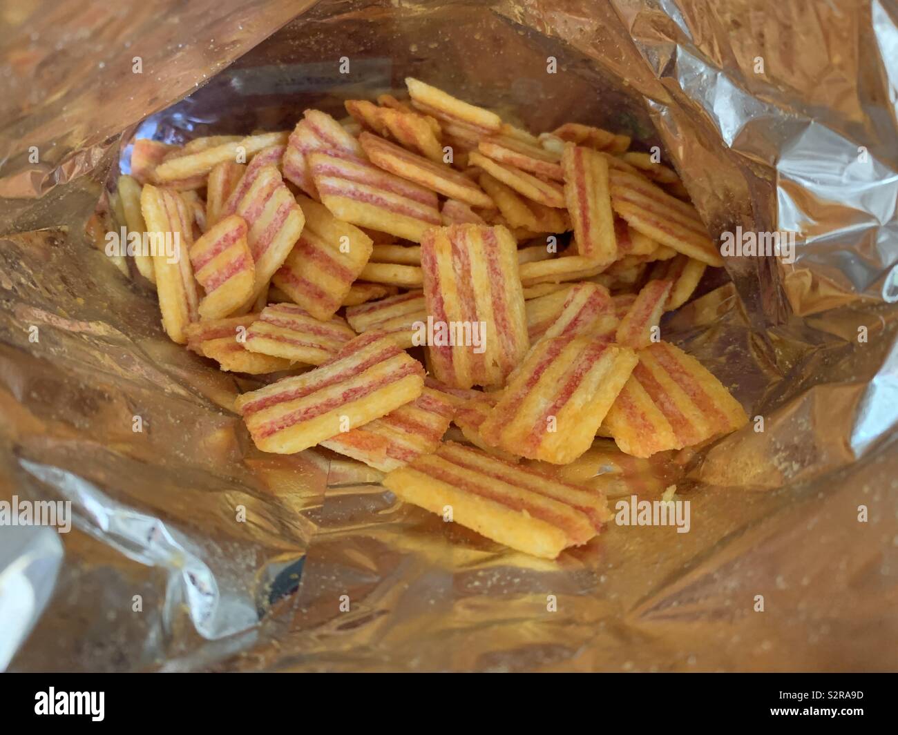 Inside a packet of bacon fries Stock Photo
