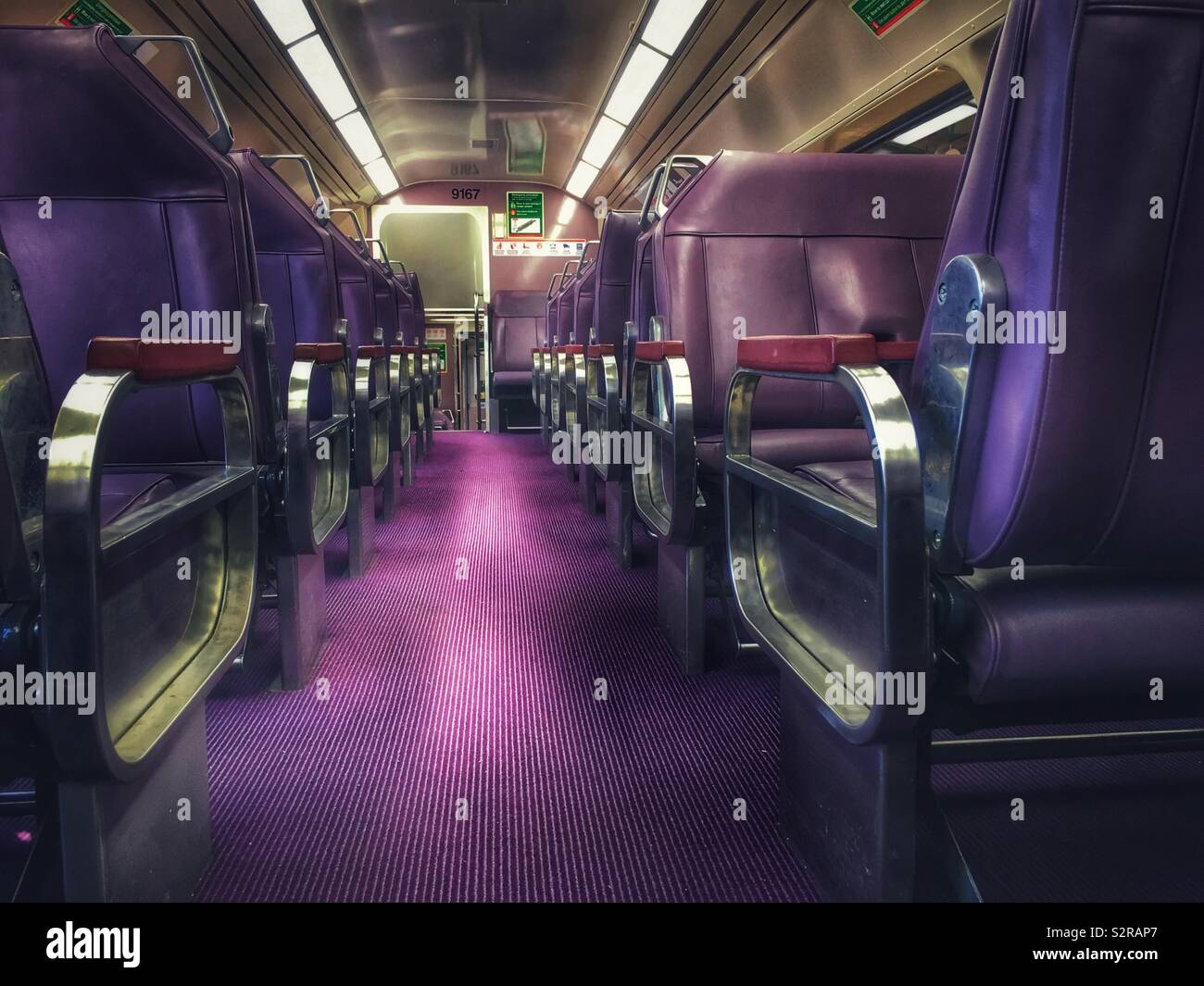 Purple train carriage in Australia on the Blue Mountains Line, operated by NWS TrainLink Stock Photo