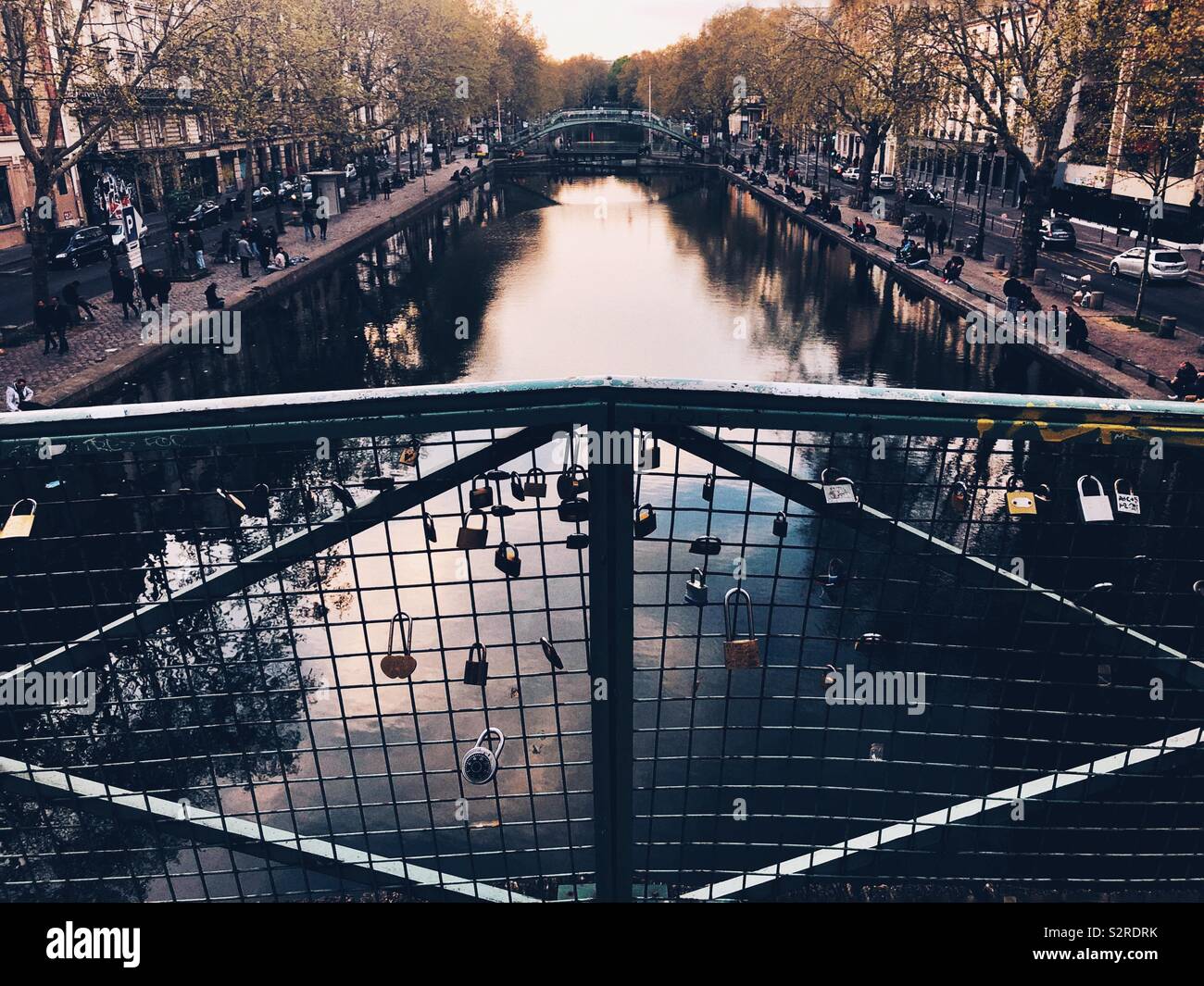 Love locks adorn bridge in Paris - Smartphone Captured Stock Image
