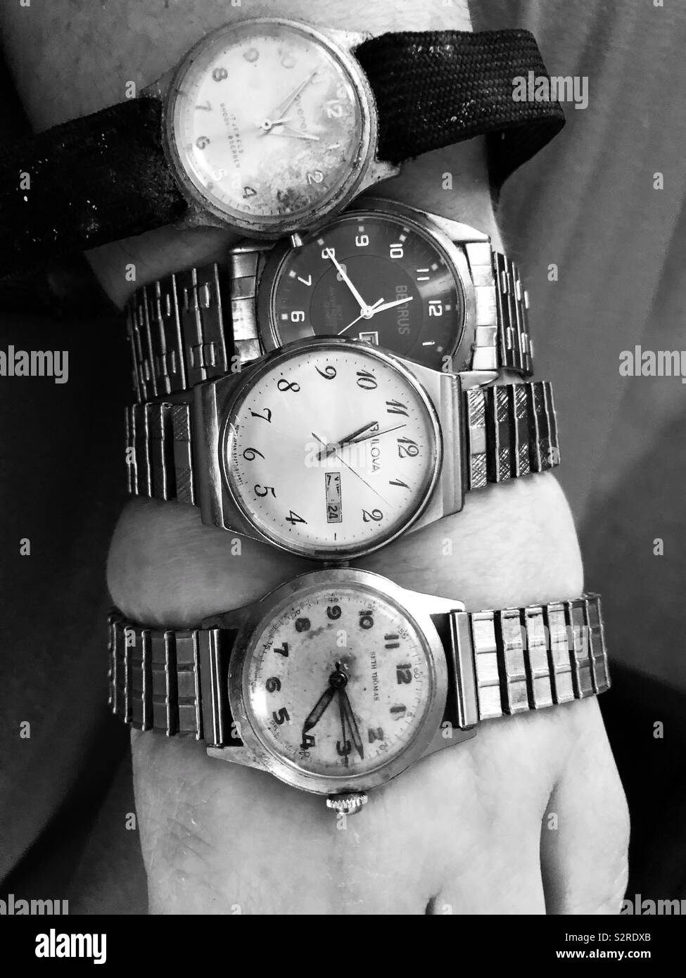 Four men’s vintage watches on a woman’s arm. - Smartphone Captured Stock Image