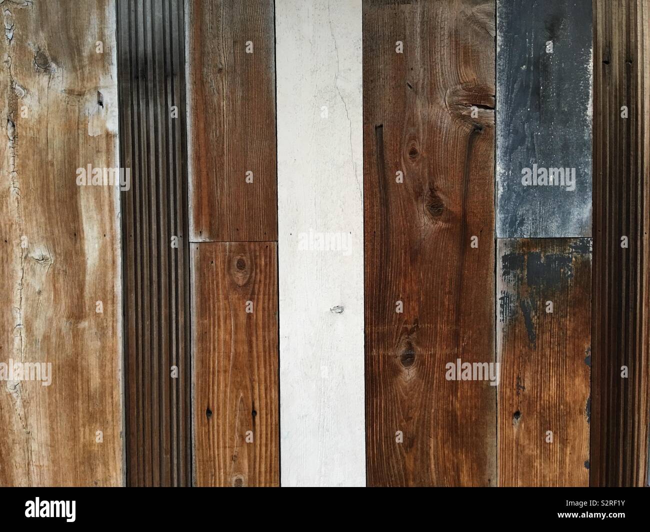 A Decorative Wall Made From Multicolored Wood Stock Photo