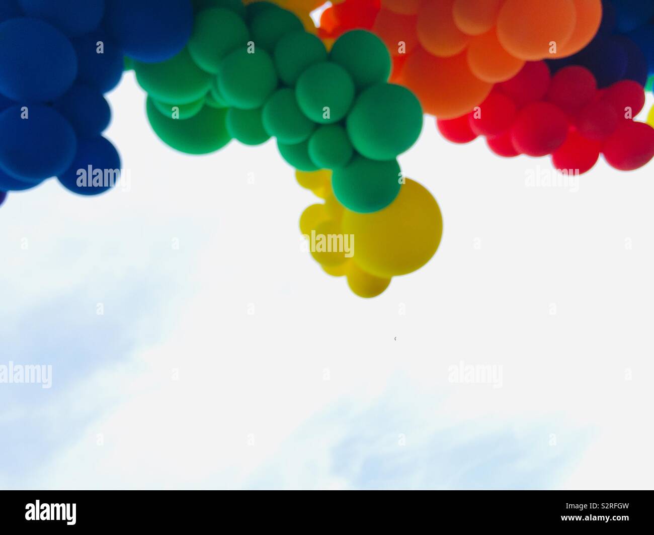 Rainbow of colorful balloons. Red, Orange, Yellow, Green, Blue and Purple Pride display. - Smartphone Captured Stock Image