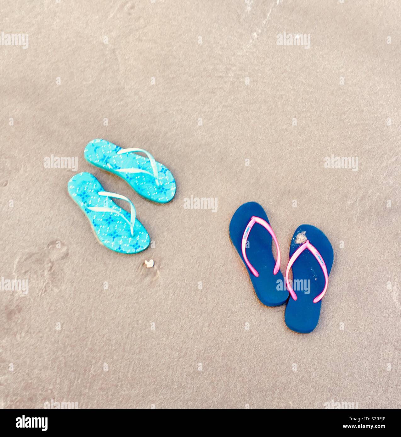 Flip flops in the sand Stock Photo