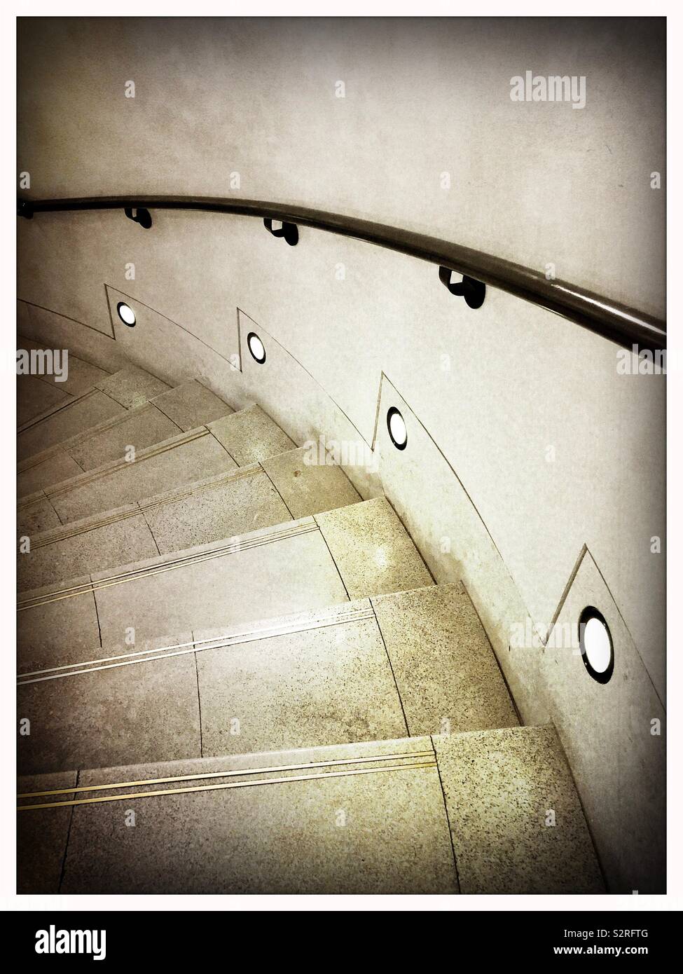 Looking down a curved staircase in the National Gallery of Scotland, Edinburgh, moody atmosphere. - Smartphone Captured Stock Image