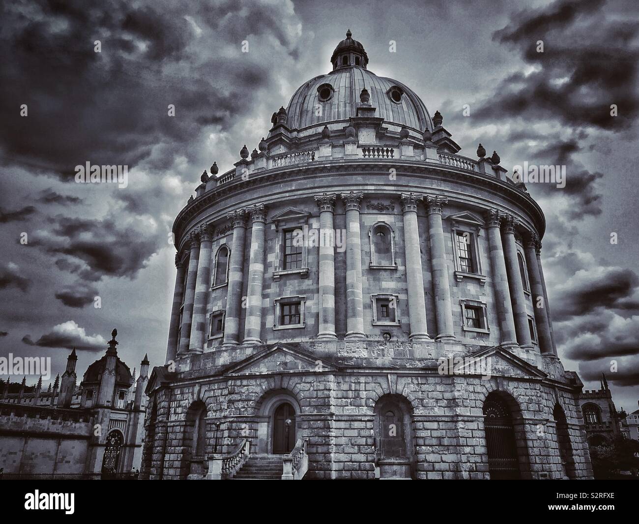 A moody & atmospheric picture of The Radcliffe Camera Building in Oxford, England. This iconic building is used as a library by the University Students. Photo Credit - © COLIN HOSKINS. - Smartphone Captured Stock Image