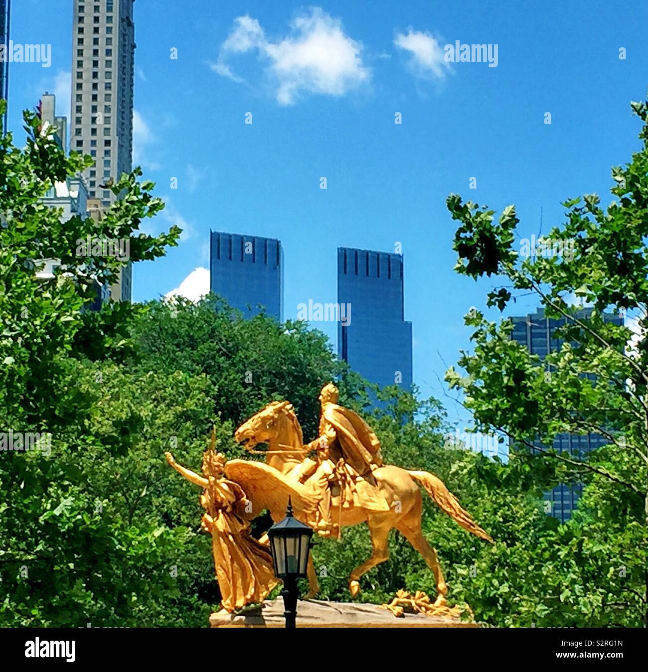 The statue of general Sherman in grand Army Plaza in central park with Time Warner building in the background, NYC, USA Stock Photo