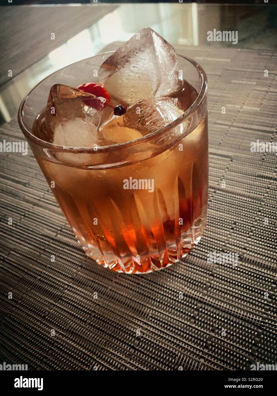 A classic bourbon Manhattan served on the rocks in a crystal glass, USA - Smartphone Captured Stock Image