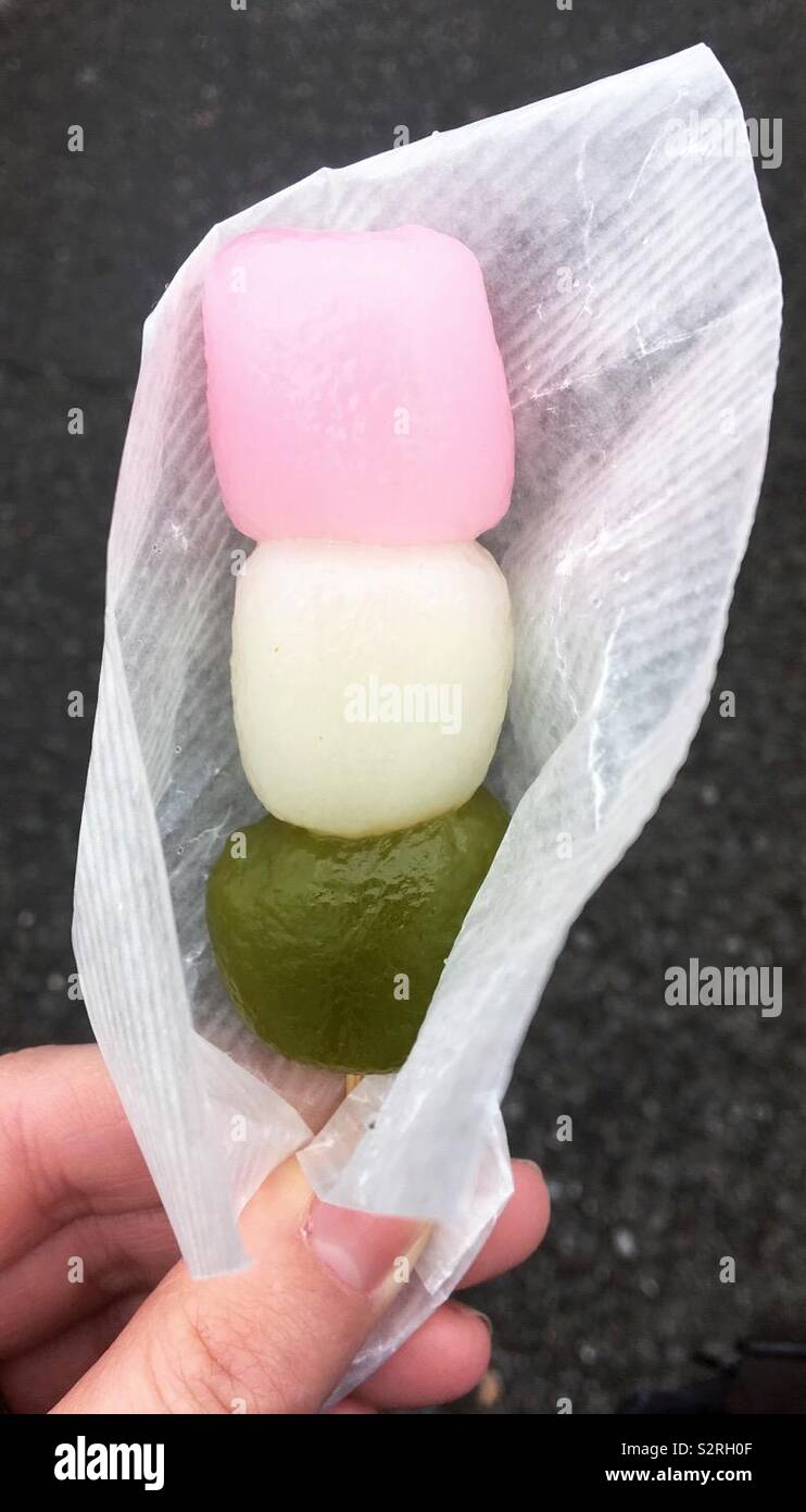 Botchan Dango, a Japanese sweet dumpling made from rice flour and served on a skewer. - Smartphone Captured Stock Image Botchan Dango, a Japanese sweet dumpling made from rice flour and served on a skewer. - Smartphone Captured Stock Image