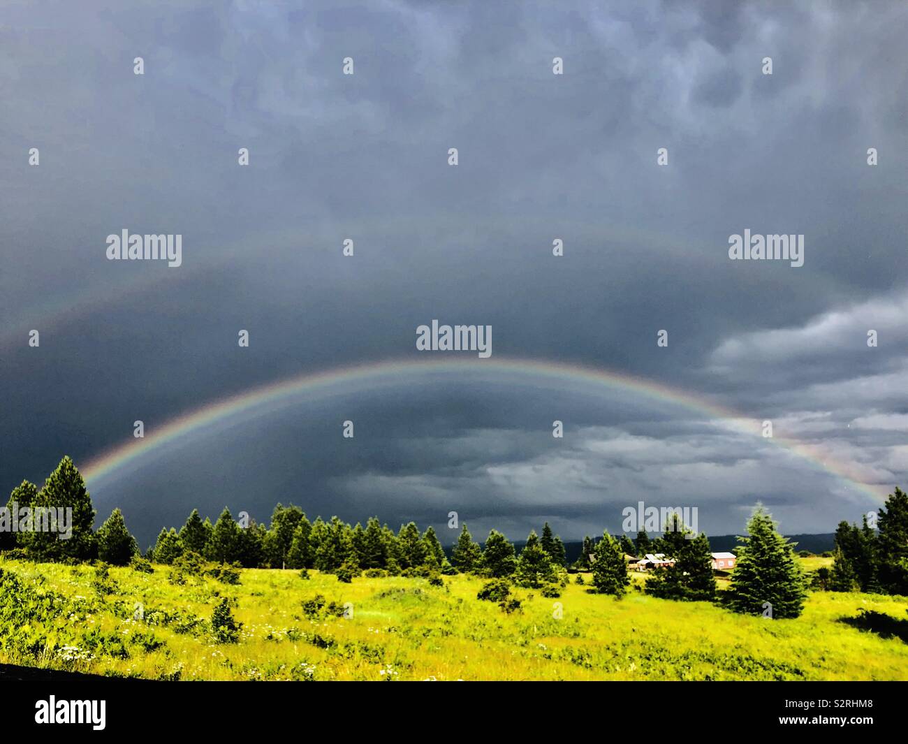 Double rainbow outside Lenore, Idaho after a late afternoon summer rainstorm Stock Photo