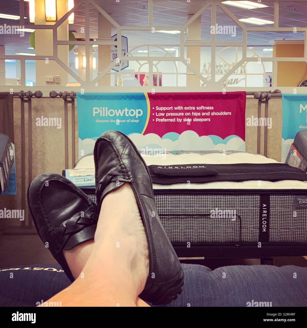 Trying mattresses at a furniture store Stock Photo Alamy