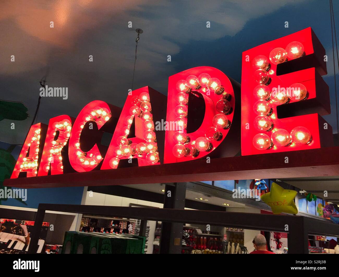 Large lighted arcade sign in Macy’s at Herald Square, NYC, USA - Smartphone Captured Stock Image