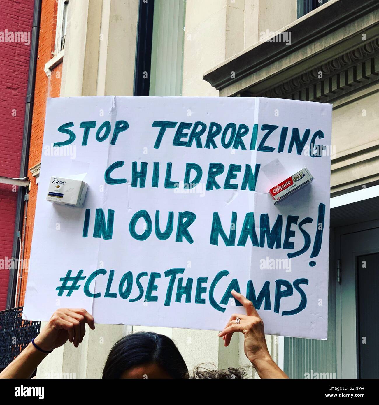 July 2, 2019. A sign at the Close the Camps Rally reads “STOP TERRORIZING CHILDREN IN OUR NAMES! #CloseTheCamps,”Middle Collegiate Church, Manhattan, New York, New York, United States. - Smartphone Captured Stock Image