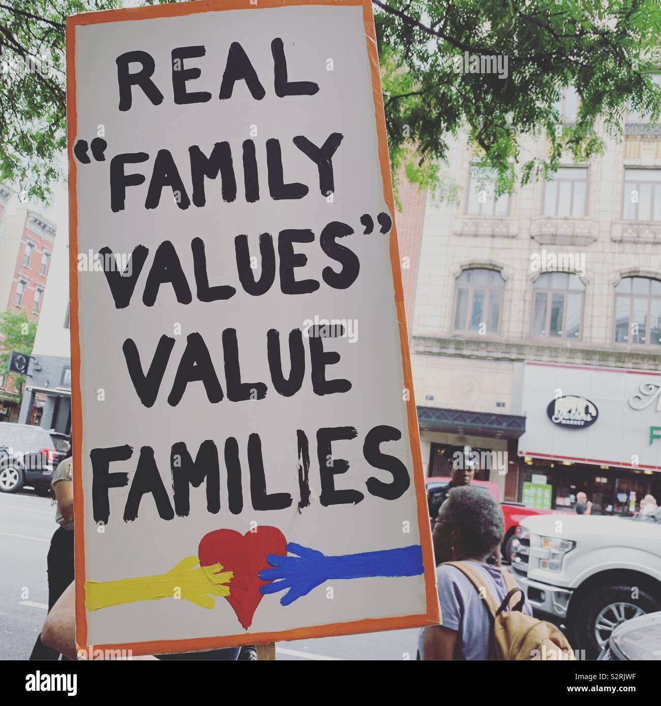 July 2, 2019. Close the Camps Rally, Middle Collegiate Church, Manhattan, New York, New York, United States. A sign reads “Real ‘Family Values’ Value Families.” - Smartphone Captured Stock Image