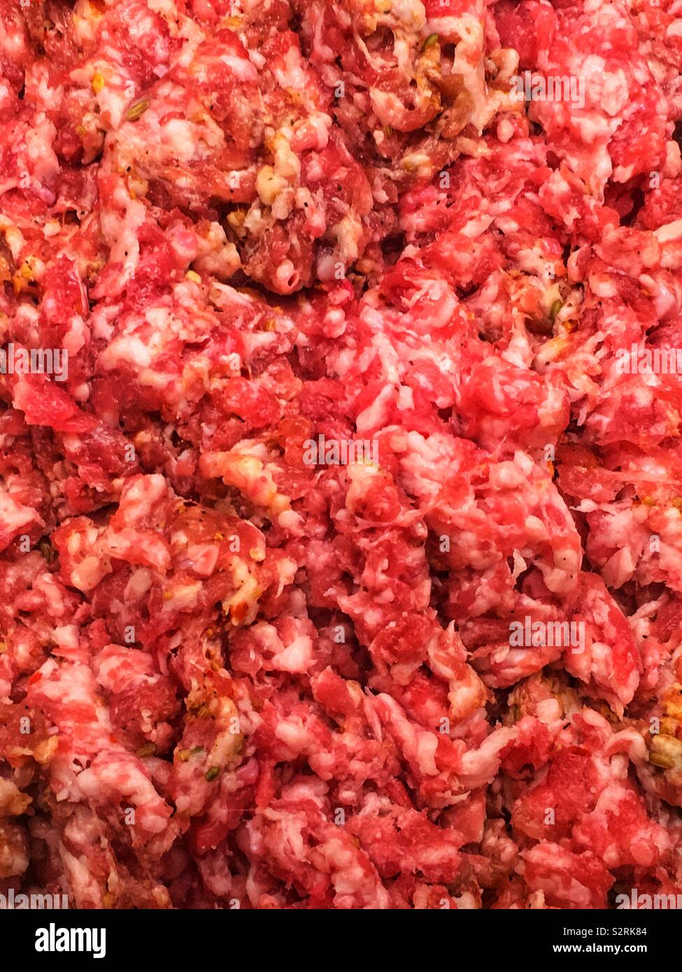 Fresh raw Italian sausage, ground and mixed in a bowl. - Smartphone Captured Stock Image