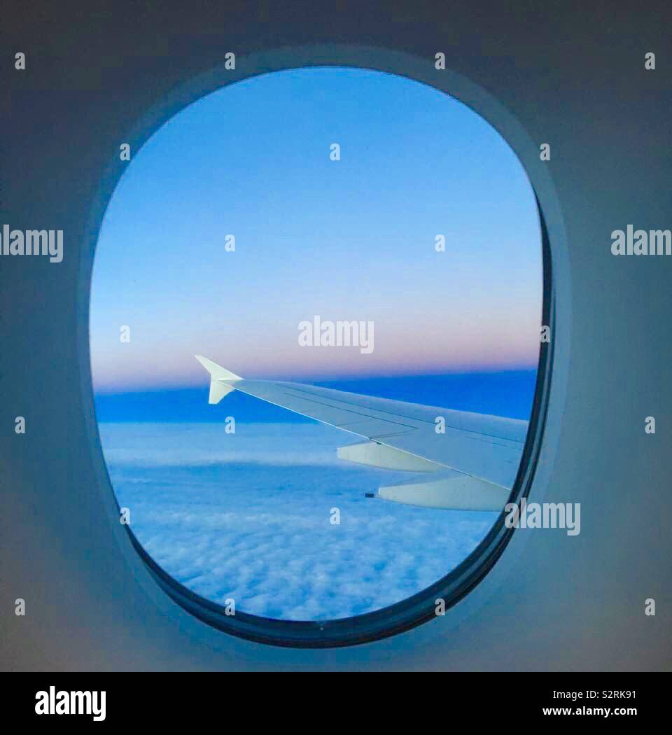 View of sunrise outside a A 380 Aeroplane window - Smartphone Captured Stock Image