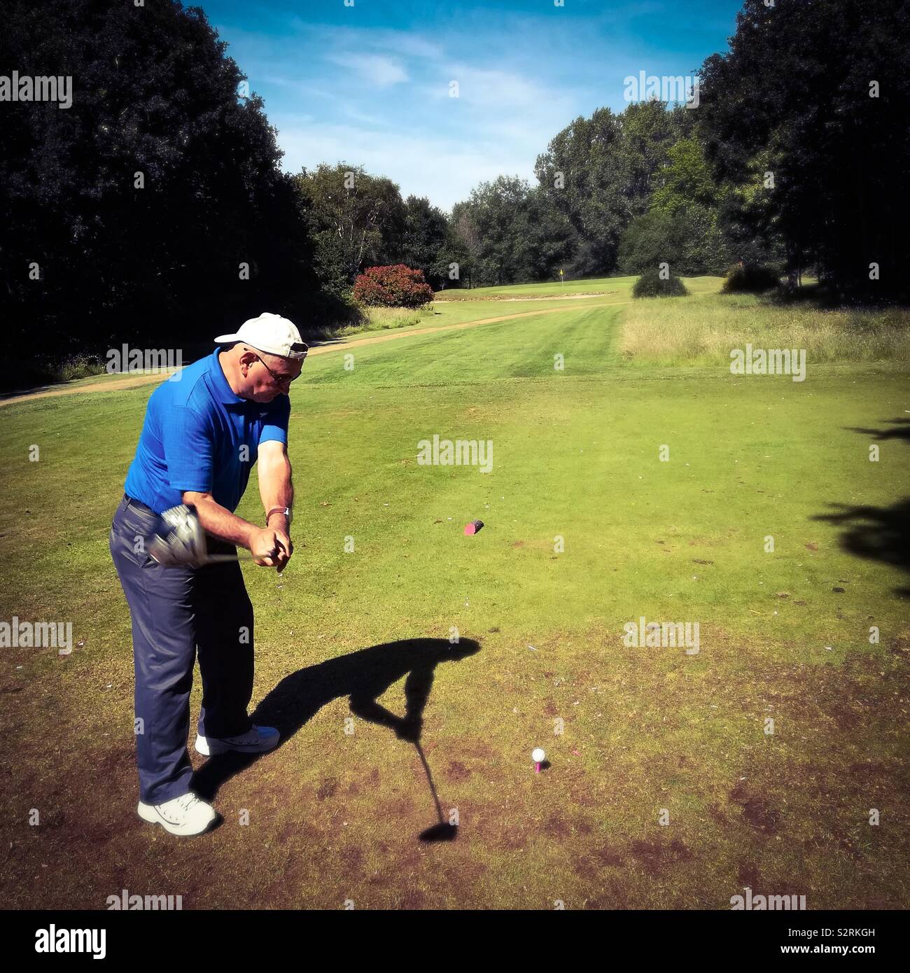 Man driving golf ball Stock Photo Alamy