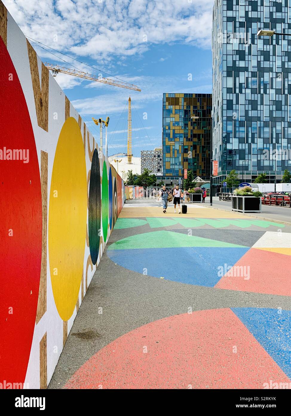 London, UK - 5th July 2019: Multi coloured approach to the O2 arena in Greenwich. - Smartphone Captured Stock Image