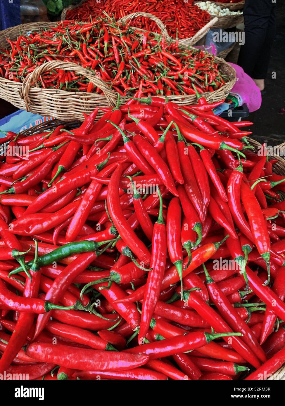 Baskets of red hot chilli peppers at the local market in Siem Reap