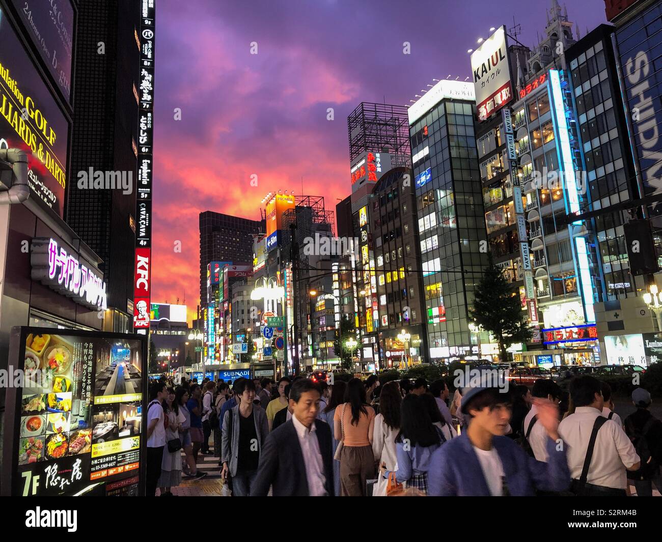 People walking against the sunset in Shinjuku, Tokyo, Japan. - Smartphone Captured Stock Image