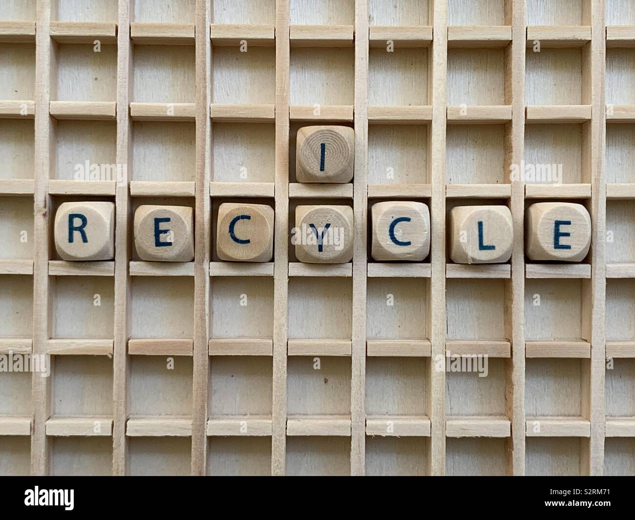 I recycle, modern slogan composed with wooden cube dice letters - Smartphone Captured Stock Image