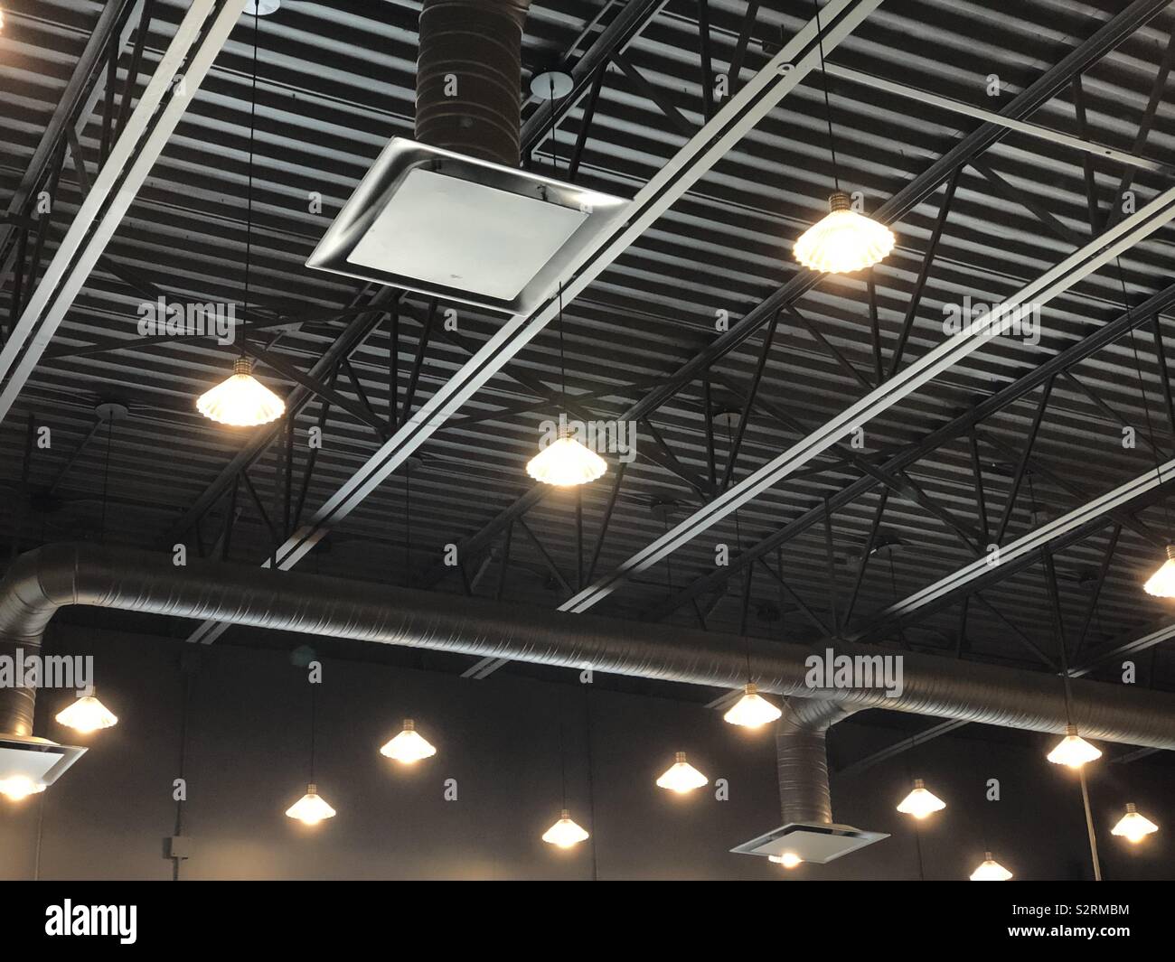 Industrial style exposed lighting installation Stock Photo