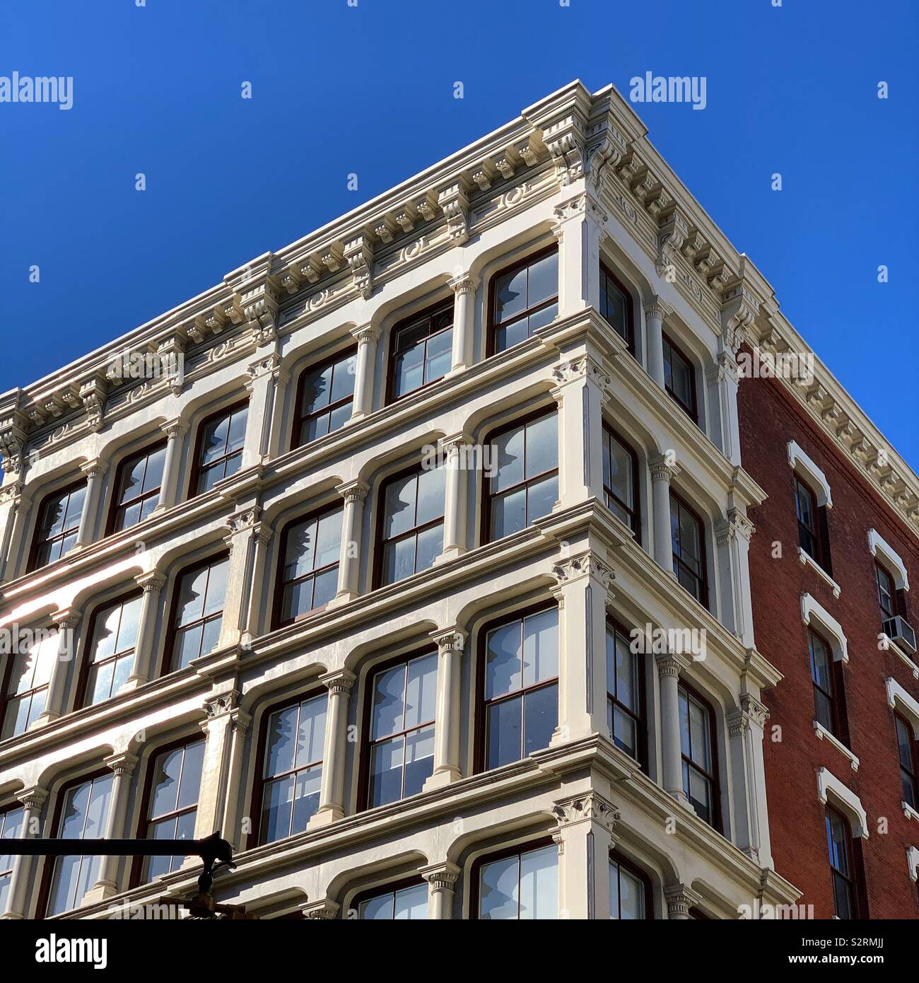 Corner of a cast iron building in SoHo, New York, New York, United States - Smartphone Captured Stock Image