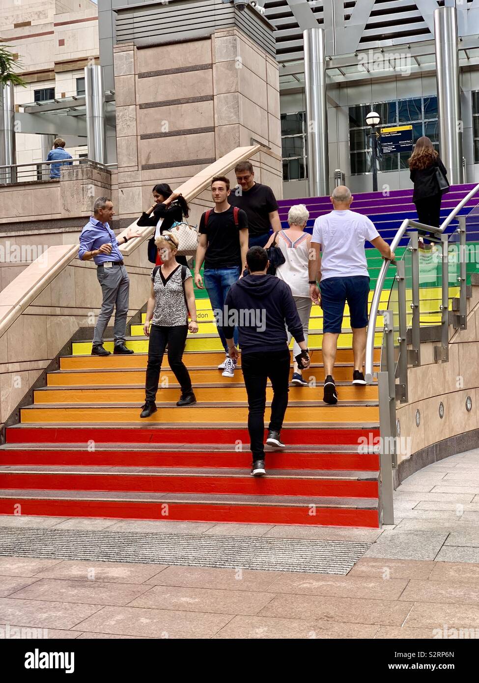 London, UK - 5 July 2019: Steps down to Reuters Plaza at Canary Wharf decorated in rainbow colours for Pride celebrations. Stock Photo