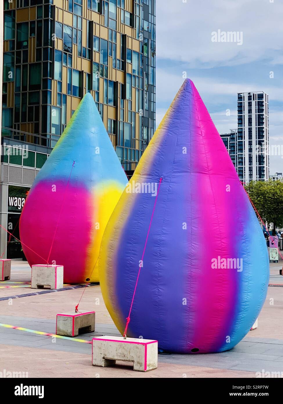 Greenwich, UK - 5 July 2019: Bright inflatable teardrop shaped art installation outside the 02 arena. Stock Photo