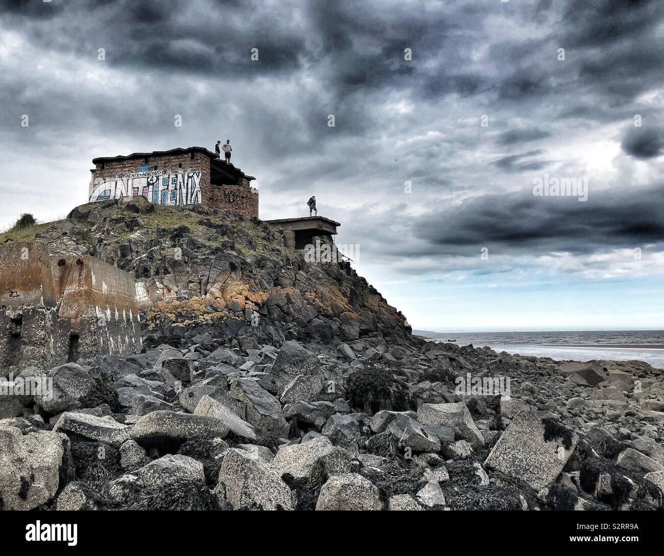 People standing on the roof of an abandoned building - Smartphone Captured Stock Image