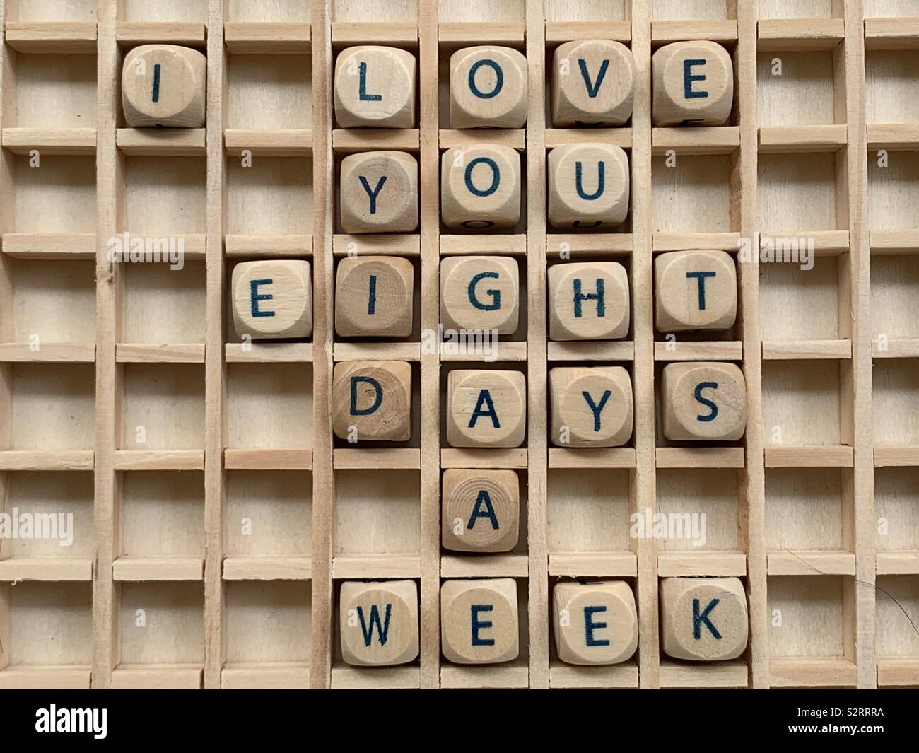 I love you eight days a week, declaration composed with wooden cube dice letters Stock Photo