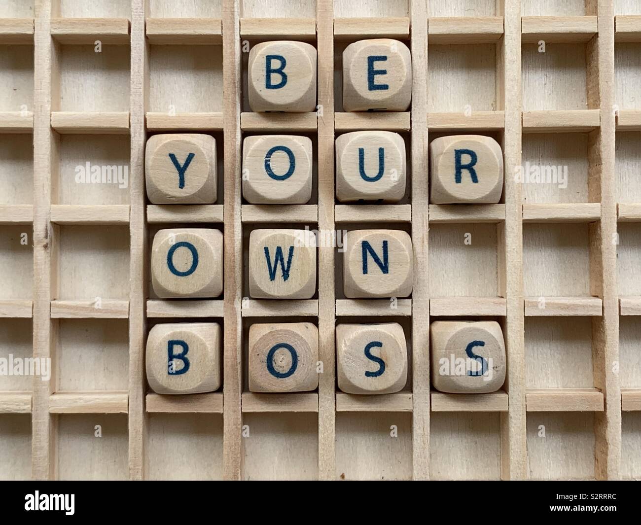 Be your own boss, motivational words composed with wooden cube dice letters Stock Photo