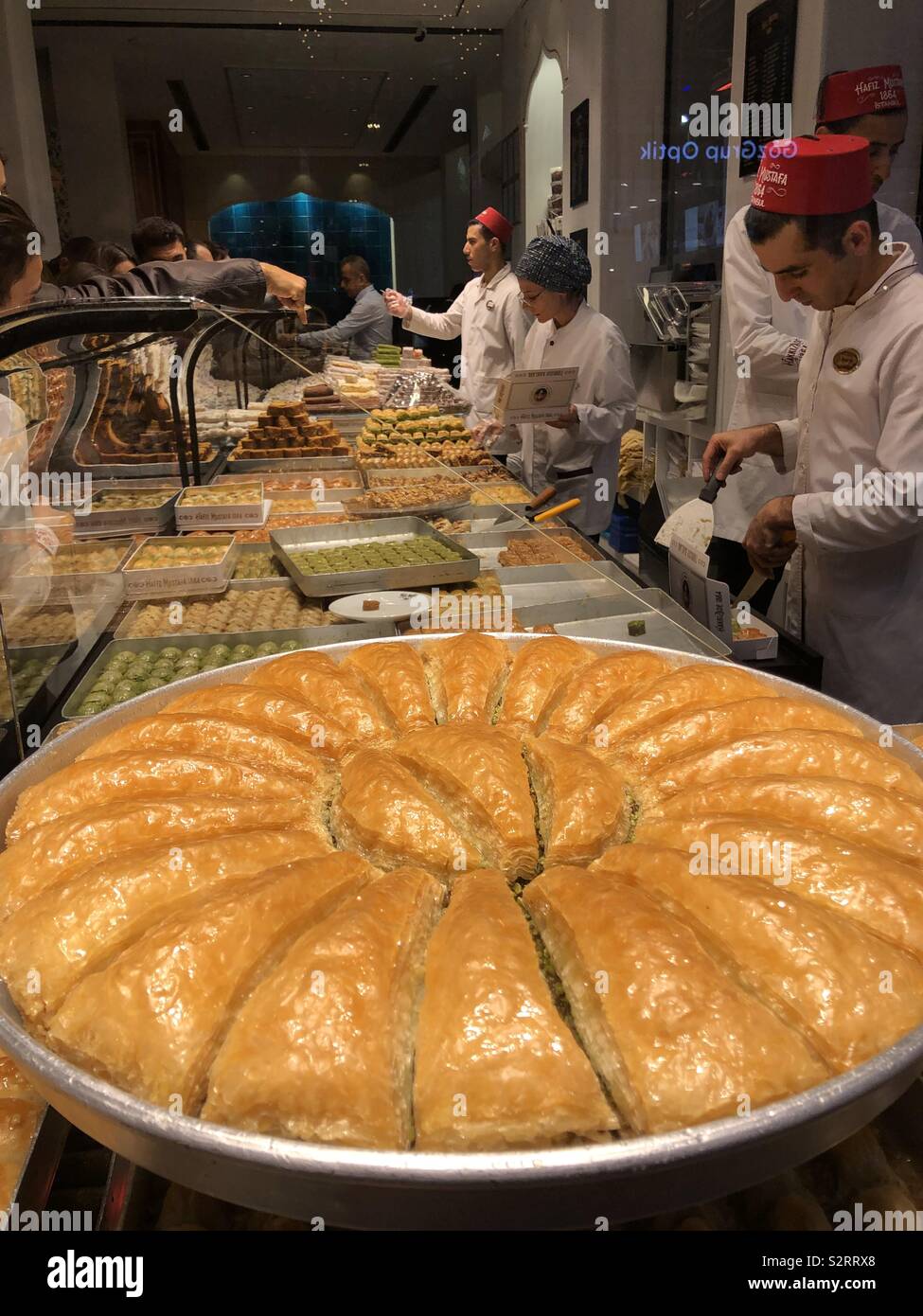Turkish Delight store with employers at work - Smartphone Captured Stock Image