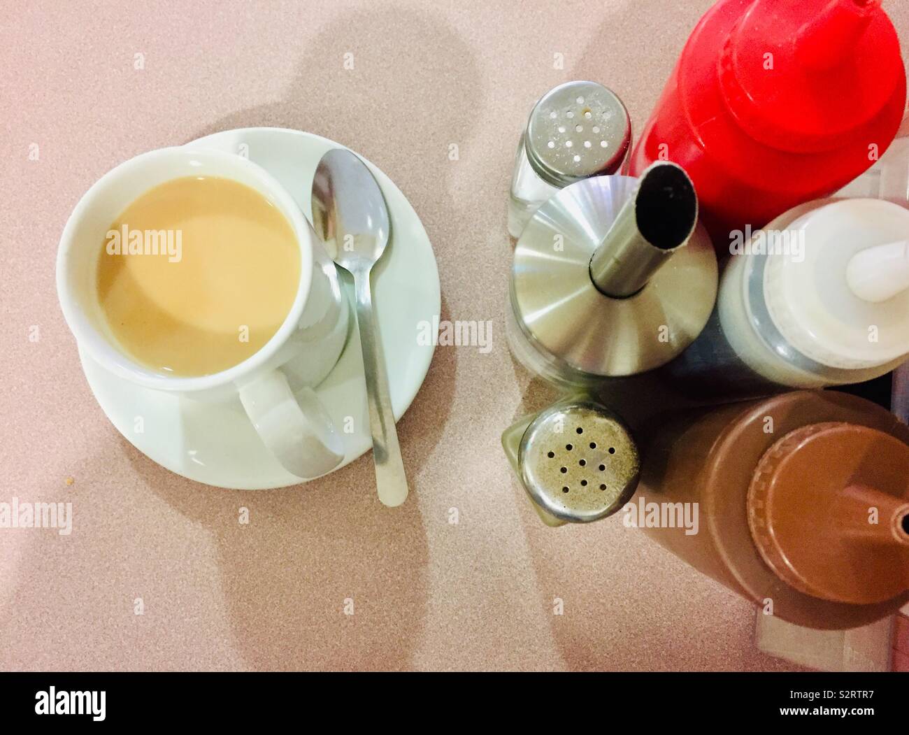 Tea and sauce bottles in a greasy spoon cafe - Smartphone Captured Stock Image