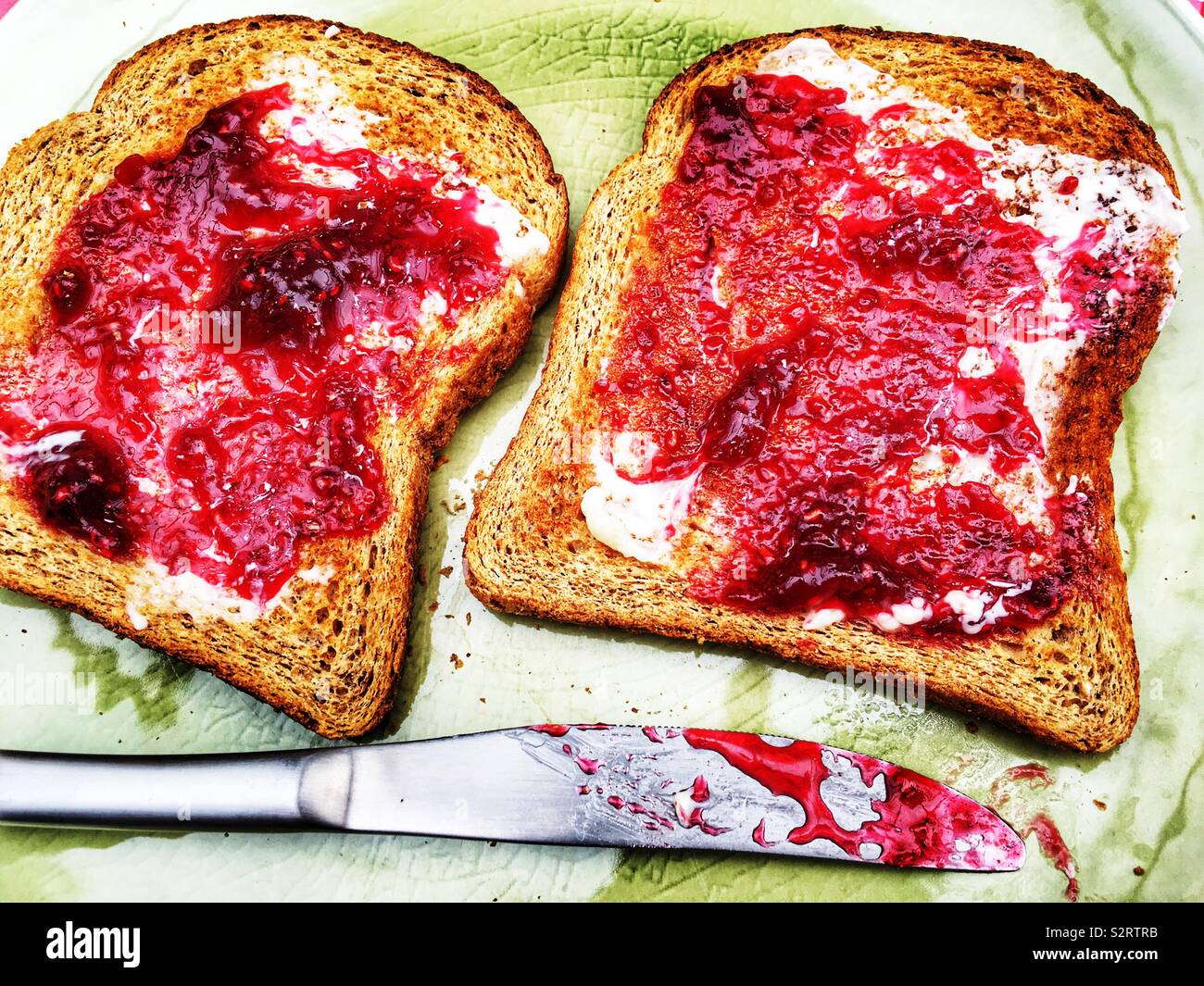 Homemade raspberry jam on wholemeal toast Stock Photo Alamy